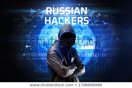 Foto stock: Faceless Anonymous Russian Computer Hacker In Darkness