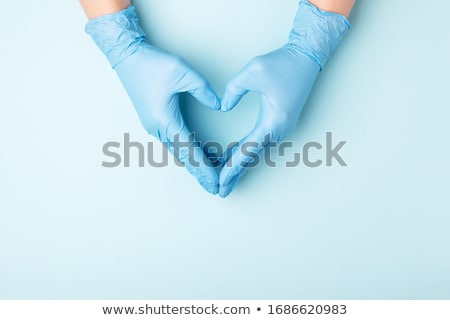 Stock photo: Heart In Surgeons Hand