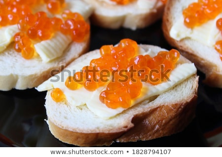 Foto d'archivio: Delicious Fish Rolls And Canape With Red Caviar Served On Plates