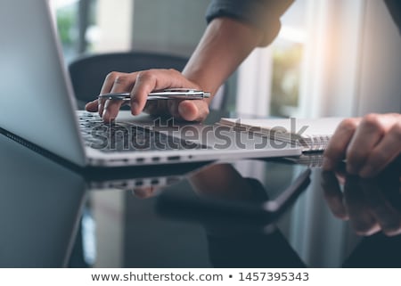 ストックフォト: Close Up Of Man Standing On Laptop