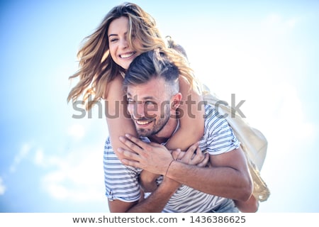 Stok fotoğraf: Couple Laughing At Camera