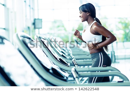 Stock fotó: African American Girl Running On Treadmill