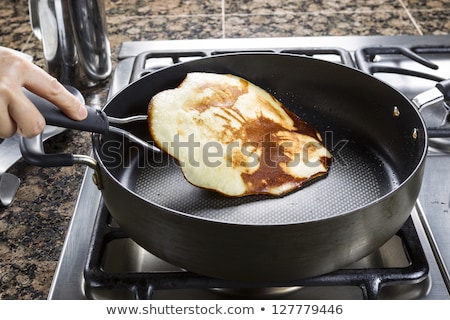 Foto d'archivio: Pancakes Cooking On The Hot Stove