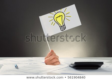 Stockfoto: Hand Holding Vision Flag With Bright Idea