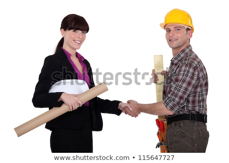 [[stock_photo]]: Businesswoman And Craftsman Shaking Hands