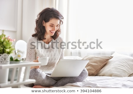 Stockfoto: Beautiful Woman Drinking A Cup Of Tea In Bed