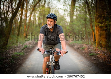 ストックフォト: Senior Man With A Bicycle Helmet