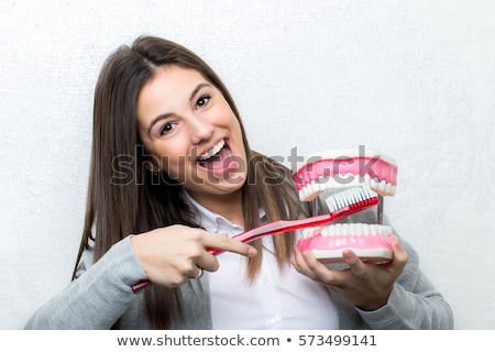 ストックフォト: Young Woman Showing Teeth Brush