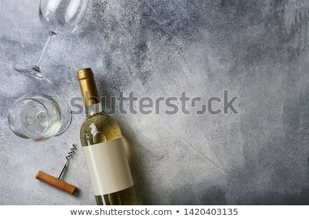 Foto stock: Glass Of White Wine And Bottle