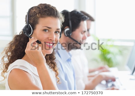 商業照片: Confident Smiling Female Customer Support Staff