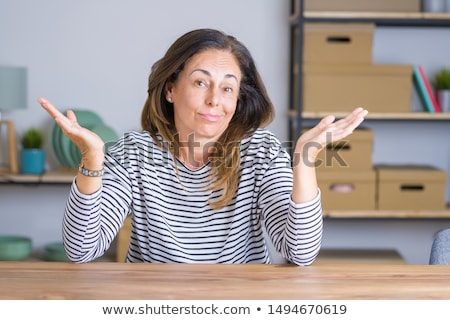 Foto stock: Confused Business Woman Shrugging Shoulders