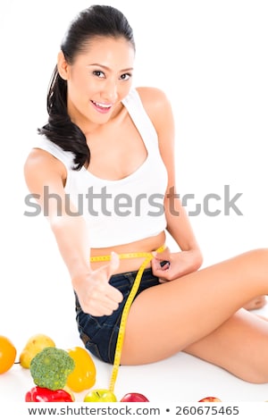 Foto stock: Young Asian Woman Losing Weight By Living Healthy