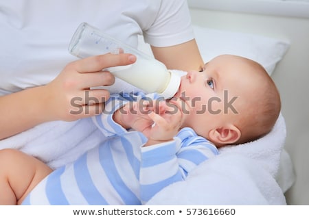 Сток-фото: Mother Holding And Feeding Baby From Bottle