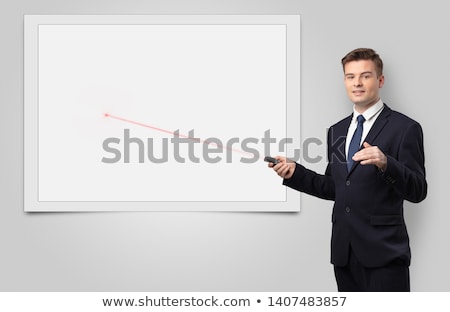 Zdjęcia stock: Businessman With Laser Pointer And Copyspace White Blackboard