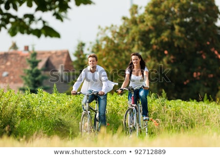 Foto stock: Happy Couple With Bicycles On Country Road