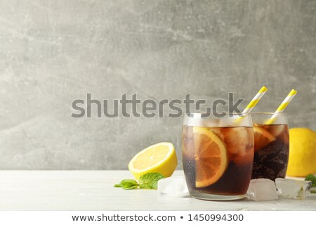 Stock foto: Glasses With Cold Cola And Citrus On White Cement Background Cl
