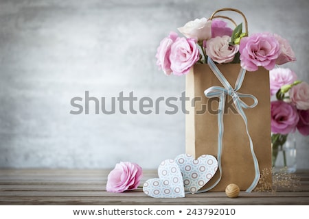 Foto stock: Grunge Paper With Bunch Of Flower On The Wooden Background