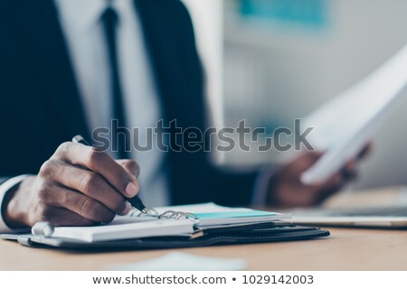 Stok fotoğraf: Businessman Writing In His Diary