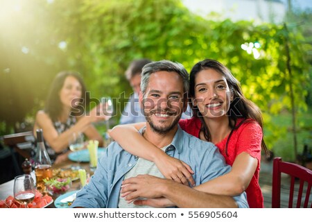 ストックフォト: Brunette Sitting And Looking At Camera