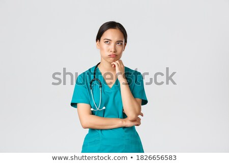 Foto d'archivio: Asian Female Surgeon Looking Bored