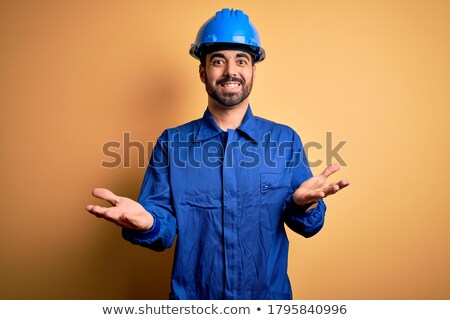 Stock photo: Mechanic With Arm Out In A Welcoming Gesture