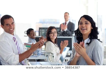 Stock fotó: Coworkers Applauding A Colleague After Presentation