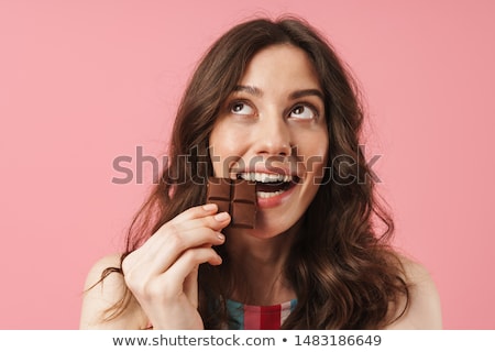 ストックフォト: Hungry Young Woman Isolated Over Pink Wall Background Holding Cup Cake