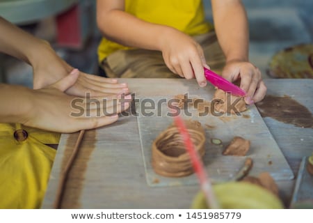 Zdjęcia stock: Mother And Son Doing Ceramic Pot In Pottery Workshop