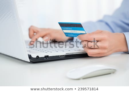 Foto stock: Business Woman Making Payments Online Using Laptop And Credit Ca