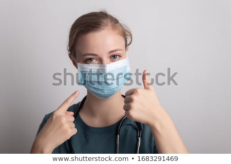 Foto d'archivio: Nurse Wearing Surgical Mask