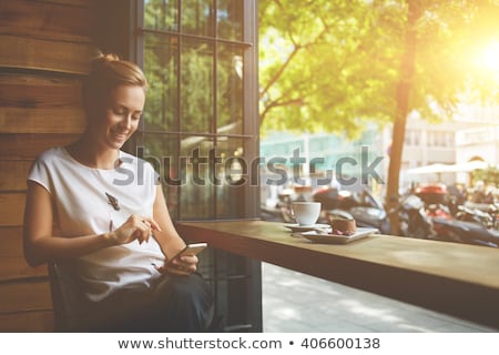 Foto d'archivio: Happy Woman At Breakfast With A Coffee