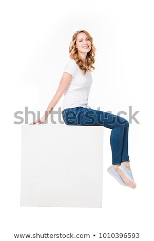 Foto stock: Beautiful Woman Posing On Cube