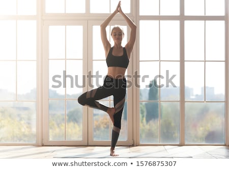 Foto stock: Woman Doing Stretching Yoga Exercises