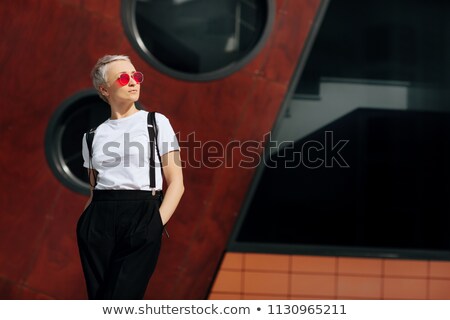 Stock fotó: Creative Portrait Of Young Woman Near Wall