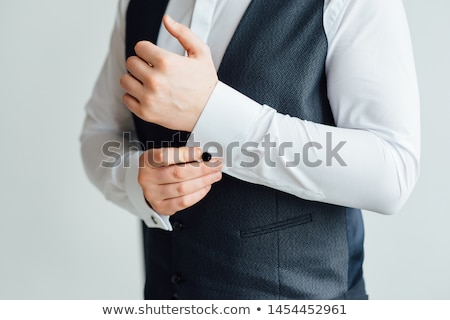 Stok fotoğraf: Close Up Of A Man In A Tux Fixing His Vintage Cufflink Groom Bow Tie Cufflinks