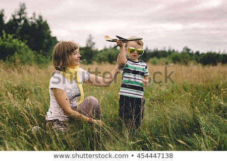 Foto stock: Happy Mother And Son Traveling By Plane