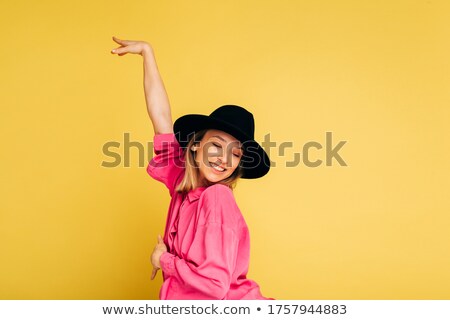 Stockfoto: Happy Young Beautiful Girl Posing Isolated Over Yellow Background Holding Blank