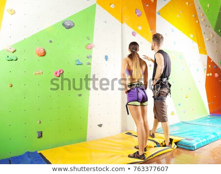 Stok fotoğraf: Couple Practicing Rock Climbing
