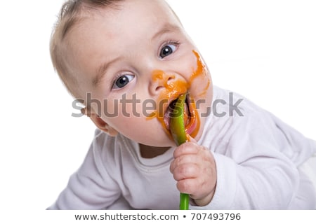 Stok fotoğraf: Adorable Baby Girl Making A Mess While Feeding