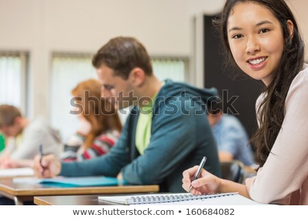 Stock fotó: Pretty Mixed Race Young Adult Female Student At Table