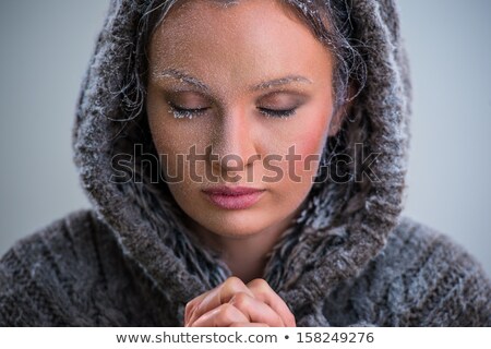 ストックフォト: Woman Praying Wearing Hoodie Frost On Her Face