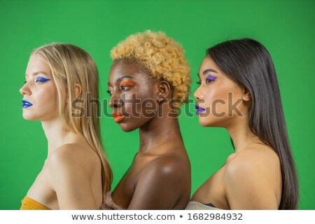 Foto d'archivio: Young Woman Standing And Smiling With Many Different Peoples Fa