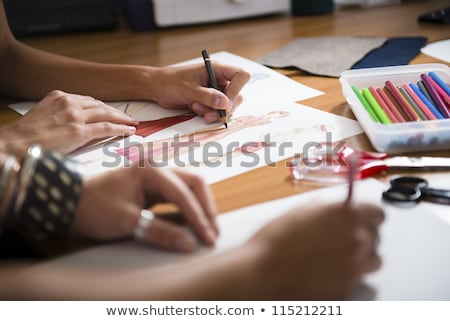 ストックフォト: Young Women Working As Fashion Designer Drawing Sketches For Clo