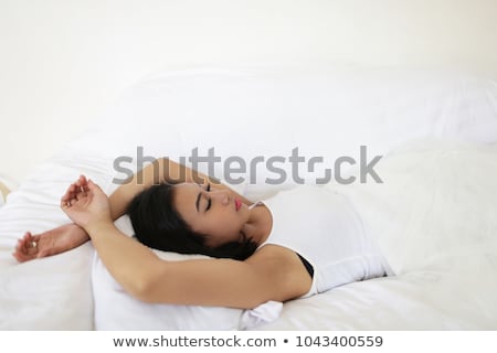 Stock photo: Pretty Indian Brunette Real Woman In Bed Smiling White Sheets
