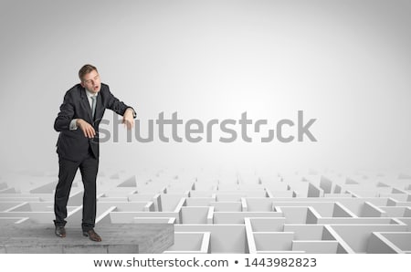 Stock photo: Sleepy Businessman On The Top Of A Labyrinth