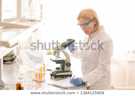 Stockfoto: Biologist Noting Observations In Laboratory