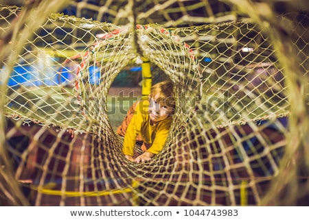 Foto stock: The Boy Passes The Obstacle Course In The Sports Club