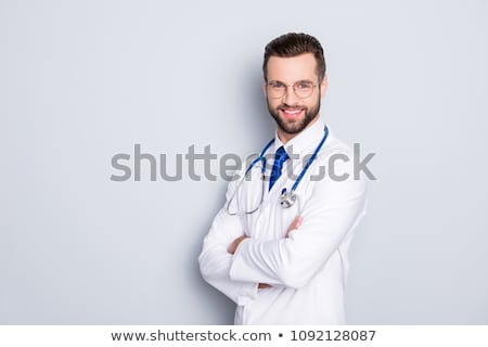 ストックフォト: Young Successful Cross Armed Doctor With Stethoscope On Neck Standing By Wall