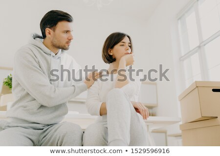 Stock fotó: Caring Husband Tries To Calm Wife In Difficult Life Situation Relocate In New House For Living Pos