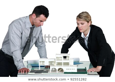 Stock photo: Two Architects Examining Scale Model Of Housing